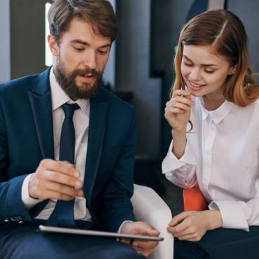 colleagues-communicate-with-tablet-technology-office colleagues-communicate-with-tablet-technology-office
